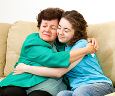 Image of a mother and her daughter hugging