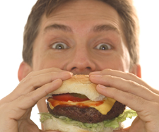 Image of a man eating a burger