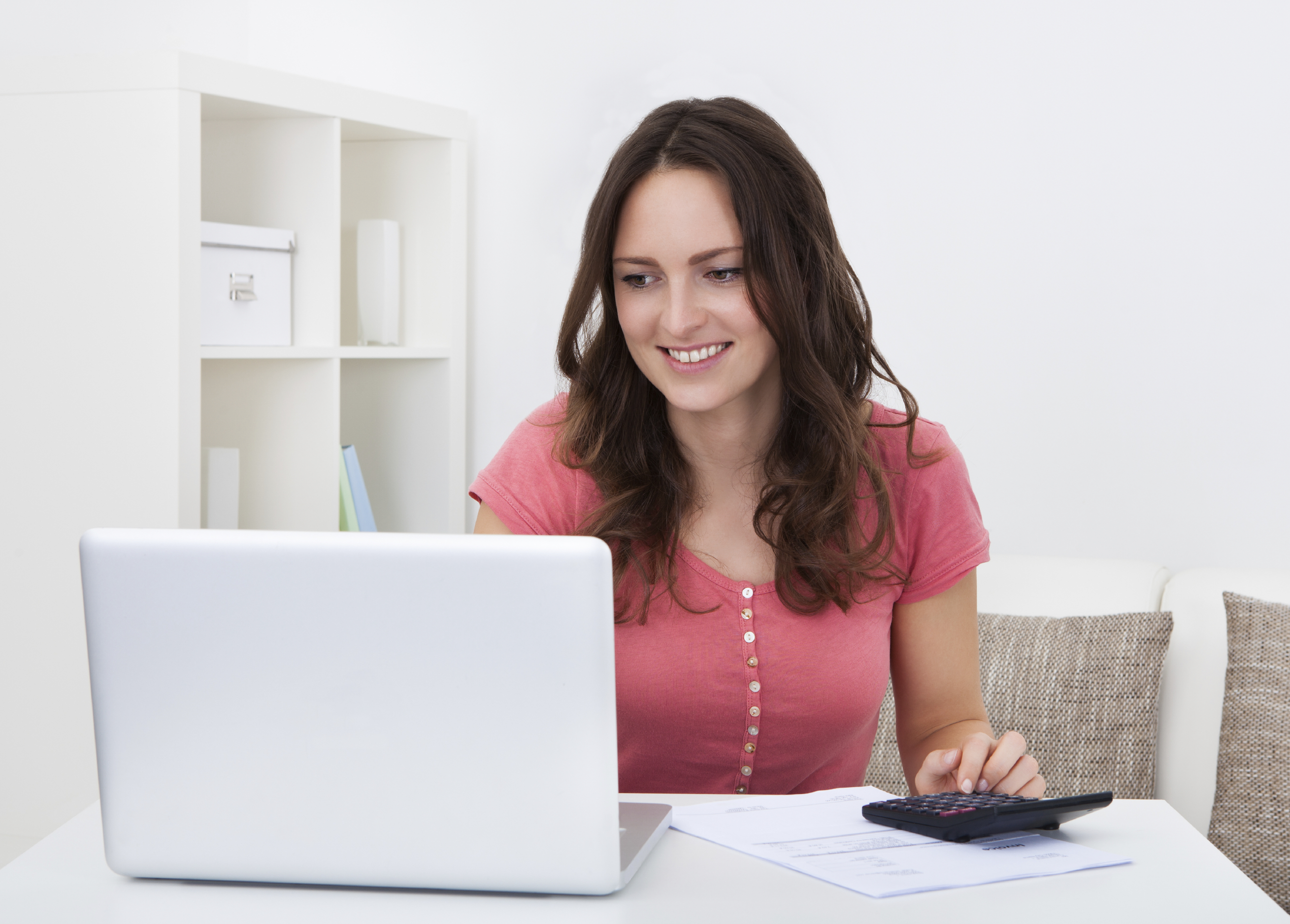 Woman doing her taxes on her laptop