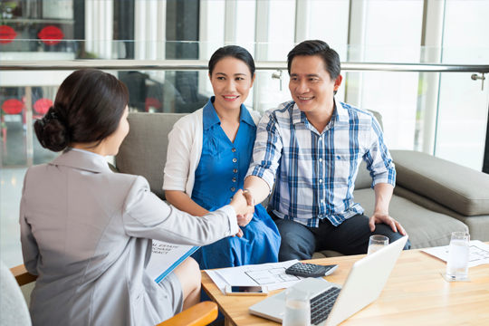 Couple meeting with their financial advisor